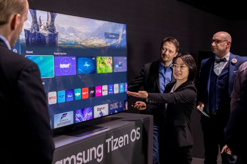Image 1: A Samsung representative demonstrating Tizen OS in February.